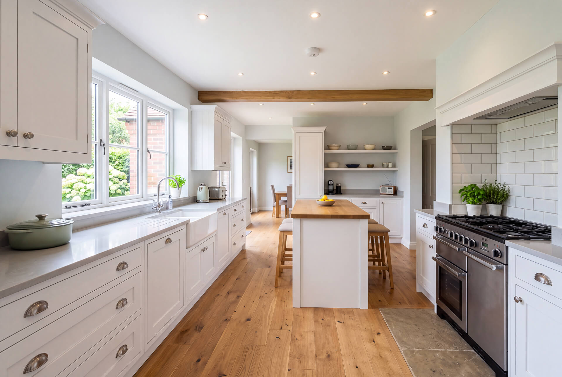 White shaker kitchen with island (Interiors): "Bright white shaker-style kitchen with island, kitchen fitting by Peak Property Maintenance in Chesterfield